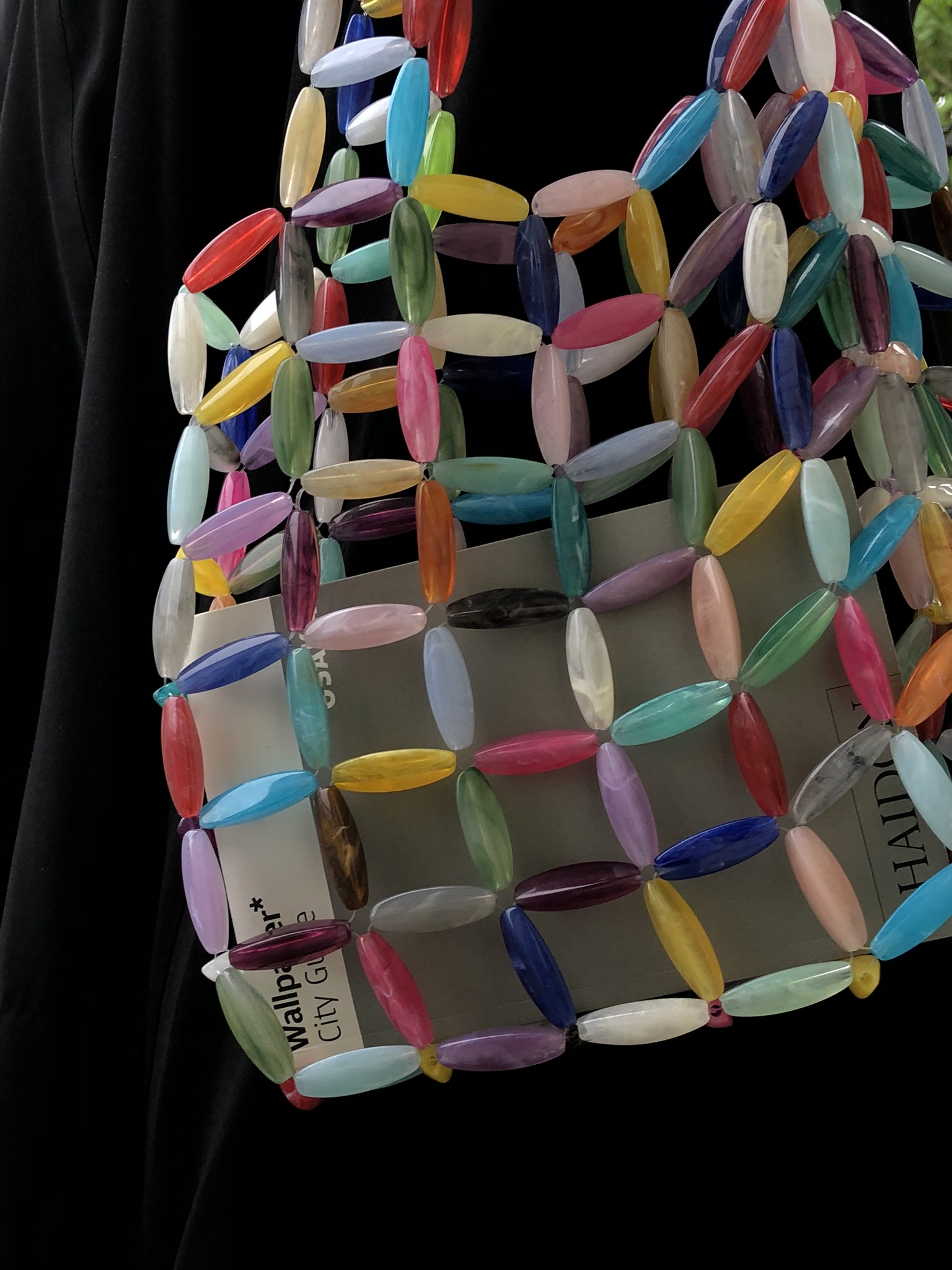 A small shoulder bag handcrafted from multicolored beads with a structured, woven design. Finished with a soft fabric lining, it securely holds essentials while adding a bright, modern touch to everyday looks.

Approx. 24 cm x 19 cm 
Strap length - 28 cm

We recommend carrying only essentials such as your phone, lipstick, wallet and sunglasses.

Acrylic beads
Includes a removable light coloured pouch

Each bag is made from a mix of beads, so color combinations may vary slightly from piece to piece.


Handcrafted in Kyiv

